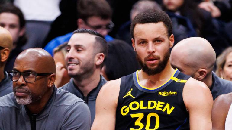 TORONTO, CANADA - JANUARY 13: Stephen Curry #30 of the Golden State Warriors sits on the bench during first half of their NBA game against the Toronto Raptors at Scotiabank Arena on January 13, 2025 in Toronto, Canada. NOTE TO USER: User expressly acknowledges and agrees that, by downloading and or using this photograph, User is consenting to the terms and conditions of the Getty Images License Agreement. Cole Burston/Getty Images/AFP (Photo by Cole Burston / GETTY IMAGES NORTH AMERICA / Getty Images via AFP)