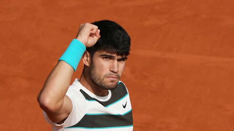 Spain's Carlos Alcaraz reacts after a point during his men's singles final match against Italy's Jannik Sinner on day 15 of the French Open tennis tournament on Court Philippe-Chatrier at the Roland-Garros Complex in Paris on June 8, 2025. (Photo by Dimitar DILKOFF / AFP)