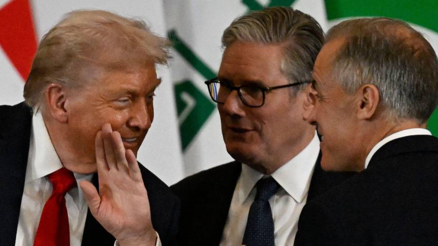 $![US President Donald Trump speaks with Britain's Prime Minister Keir Starmer and Canada's Prime][Minister Mark Carney during a summit on Gaza in Sharm el-Sheikh on October 13, 2025. Trump landed in Egypt]
