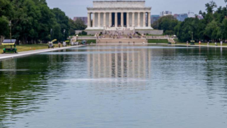 WASHINGTON, DC - JUNE 14: The Lincoln Memorial Reflecting Pool is pictured after it was recently painted blue on June 14, 2026 in Washington, DC. The reflecting pool construction project started in April and work was completed last week as part of President Donald Trump’s plan ahead of the nation’s 250th anniversary. Tasos Katopodis/Getty Images/AFP (Photo by TASOS KATOPODIS / GETTY IMAGES NORTH AMERICA / Getty Images via AFP)